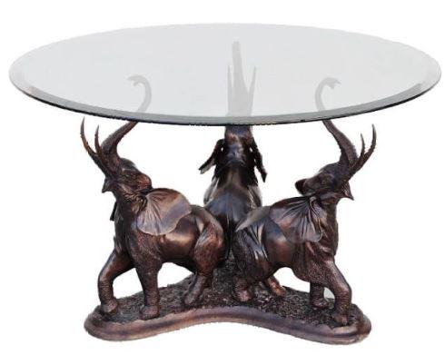 MAITLAND SMITH BRONZE THREE ELEPHANT TABLE 54": VINTAGE MAITLAND SMITH BRONZE THREE ELEPHANT TABLE BASE WITH TRUNKS UP -BRONZE BASE GLASS TOP-29" X 32" X 32" APPROX TO BASE-54" DIAMETER TO GLASS-VERY GOOD PRE OWNED CONDITIONTHIS ITEM IS LOCATED ON-