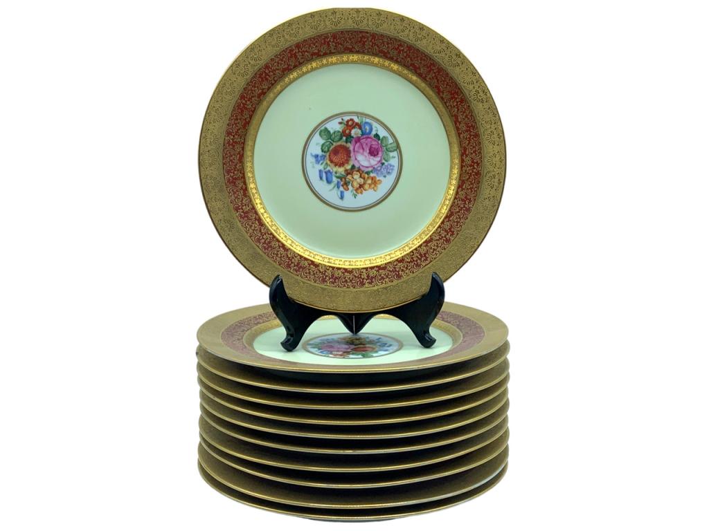 VTG ROSENTHAL GOLD ENCRUSTED DINNER PLATES (11): -VTG ROSENTHAL GOLD ENCRUSTED DINNER PLATES (11) -WHITE PORCELAIN PLATES WITH FLORAL MOTIF IN CENTER -GOLD ENCRUSTED FLORAL SCROLL ALL AROUND-PLATES MEASURE: 10.75" DIAMETER -SET OF 11 PLATES-STAMPED