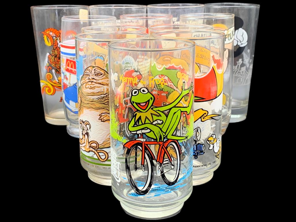 COLLECTION OF CARTOON DRINKING GLASSES (12): COLLECTION OF CARTOON DRINKING GLASSES-VERY GOOD CONDITION-12 PIECE SET-4 TALL GLASS SIZE: 6.5" X 2"-3 MEDIUM GLASS SIZE: 6" X 2"-5 GLASS SIZE: 5.5" X 2"-KA 6/6/23 BAG RM