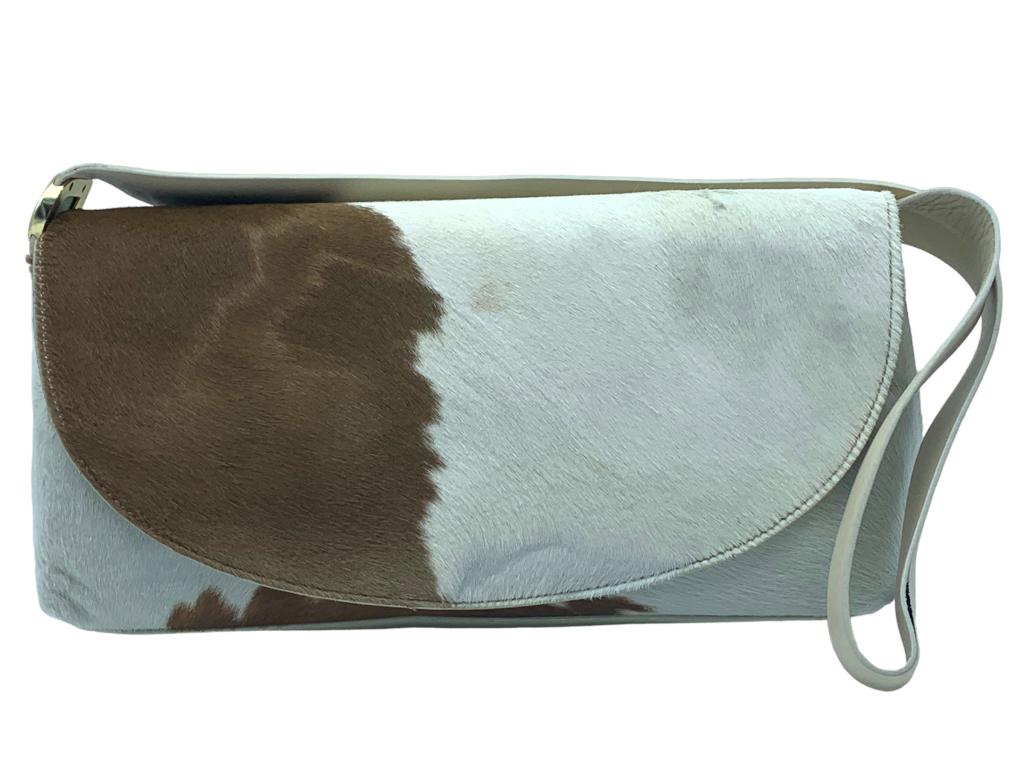 DKNY COW HIDE LEATHER HANDBAG: -DKNY COW HIDE LEATHER HANDBAG -SIZE: 11" X 5.5"-GOOD PREOWNED CONDITION -JR SR 06/15