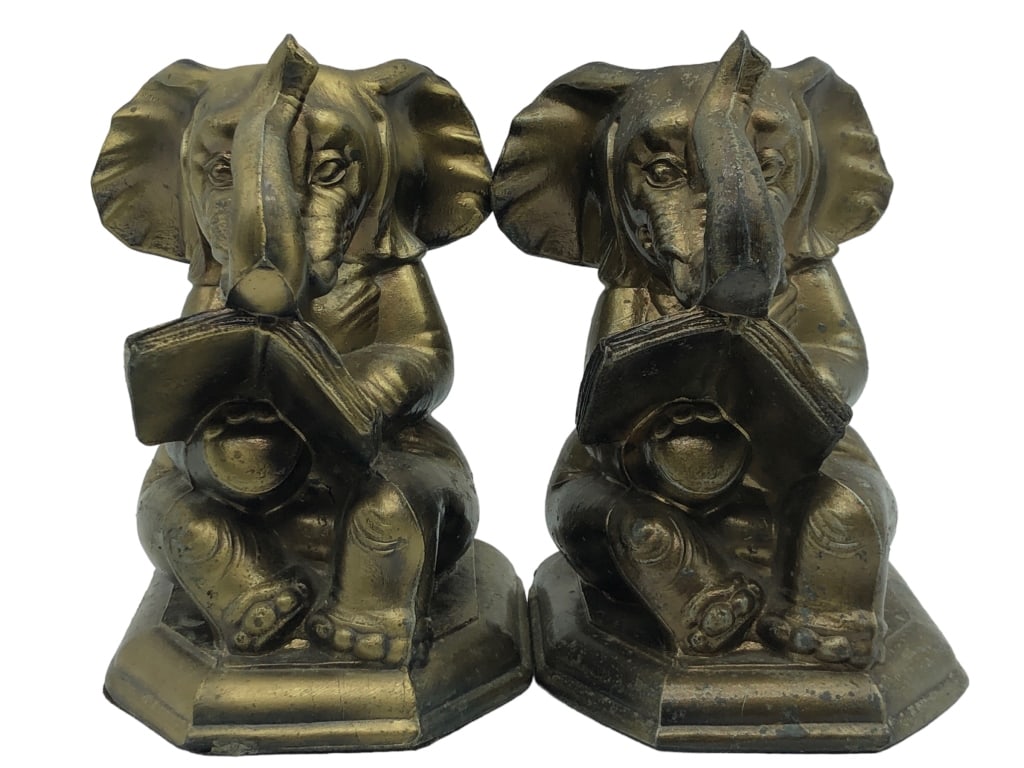 PAIR OF GOLD ELEPHANT BOOKENDS 6": PAIR OF GOLD ELEPHANT BOOKENDS-CAST METAL MATERIAL-6" X 4" APPROX-PRE OWNED CONDITION-DP6523***A PORTION OF THESE PROCEEDS WILL BE DONATED TO JOYS HOUSE A 501C CHARITY Bidders may pick up their items 