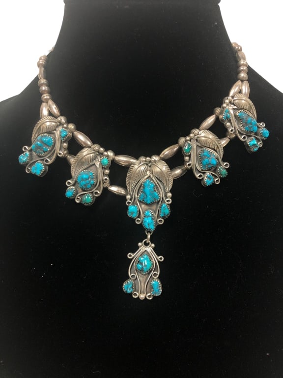 JIMMY LARRY 6 MEDALLION CHOKER W/ KINGMAN NUGGETS: 6 MEDALLION CHOKER WITH KINGMAN NUGGETS -VERY GOOD PER-OWNED CONDITION72.7GARTIST: JIMMY LARRY Please be advised that by placing a bid, you are entering into a legally binding contract with DejaVu Est