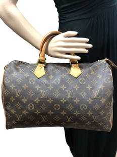 LOUIS VUITTON SPEEDY HANDBAG SIZE 35: LOUIS VUITTON SPEEDY HANDBAG- SIZE 35 -BROWN COATED CANVAS- MONOGRAM CANVAS- VACHETTA WITH GOLDEN BRASS HARDWARE- 14*8.5*7 INCHES -SP0969 -CONDITION RATING AB- -DV5- AAO2695