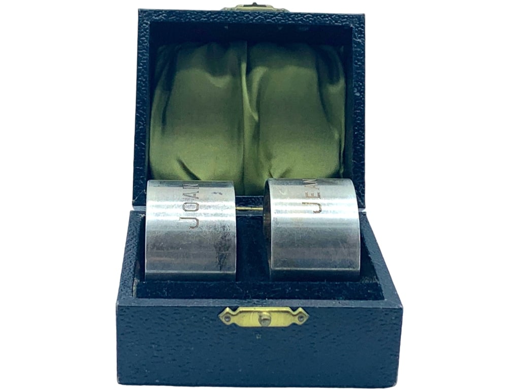 STERLING SILVER NAPKIN RINGS (2) 1.75": STERLING SILVER NAPKIN RINGS (2) 1.75" -ENGRAVED "JOAN" & "JEAN " -TOTAL WEIGHT 64g-SIZE: 1.75"JR BTW GLS CSE 04/04