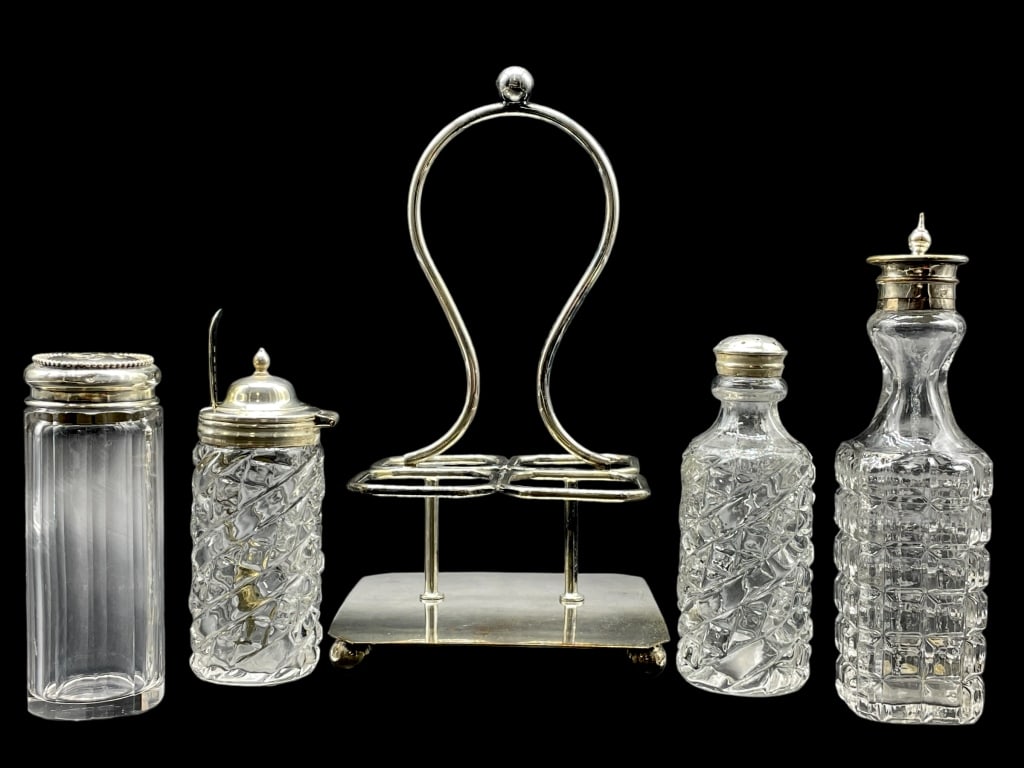 VTG GLASS & STERLING SILVER CRUET SET: -VTG GLASS & STERLING SILVER CRUET SET - 4 CRUETS -1 CADDY-1 SPOON-SEE ALL PHOTOS -JR SR BAC CBY 10/20 Bidders may pick up their items from the auction-house or have their items shipped.Appointments a