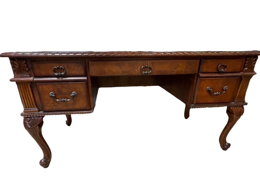 CARVED WOOD EXECUTIVE OFFICE DESK 60": CARVED WOOD EXECUTIVE OFFICE DESK-30.5" X 60" X 30" APPROX-GOOD PRE OWNED CONDITION, MINOR WEAR TO TOP -DP102423 Bidders may pick up their items from the auction-house or have their items shipped. App