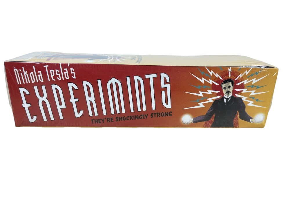 CARTON OF NIKOLA TESLA'S EXPERIMINTS - 8 TINS NIB: BOX OF NIKOLA TESLA'S EXPERIMINTS - 8 TINS NIB