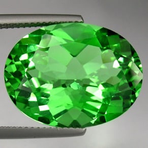 22.05 CT EMERALD GREEN GREEN TOPAZ GEM $440: EMERALD GREEN GREEN TOPAZColor: Emerald GreenSize: 15.10mm x 20.10mmWeight/Hardness: 22.05 cts. / 8Shape: Oval Checkerboard CutClarity: IFLuster: ExcellentOrigin: SwitzerlandCondition: NewTreatment: L
