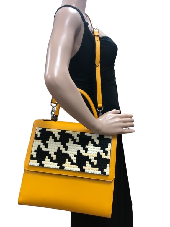 NEW LES PETITS JOUEURS LEGO PURSE $1350: - NEW LES PETITS JOUEURS LEGO PURSE $1350 - COMES WITH TAG AND DUST BAG- SIZE: 11"L X 11"H- MADE IN ITALY- GF 11/1/23 This item can qualify for in-house shipping. Please contact us if you would l