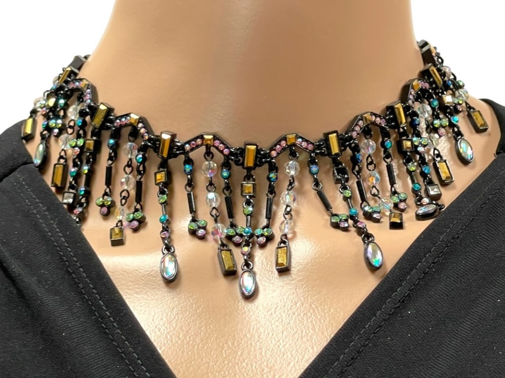 VINTAGE MULTICOLOR CRYSTAL BIB NECKLACE 17": VINTAGE MULTICOLOR CRYSTAL BIB NECKLACE ON BLACK CHAIN-17" TOTAL LENGTH-VERY GOOD PRE OWNED CONDITION-DP31324 This item can qualify for in-house shipping. Please contact us if you would like to u