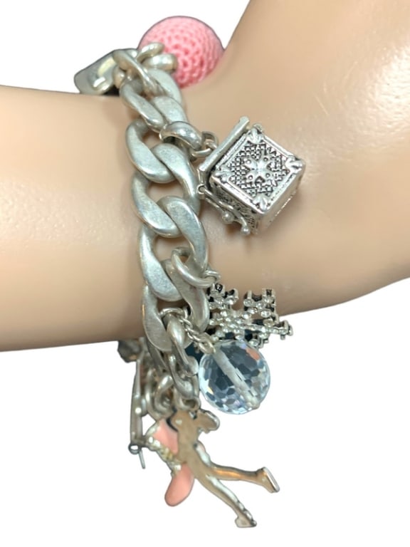 JUICY COUTURE CHARM BRACELET: CHARM BRACELET BY JUICY COUTURE-SILVER AND PINK COLOURS -HALLMARKED JUICY COUTURE-GOOD PRE OWNED CONDITION | SLIGHT WEARBD41224STFRT