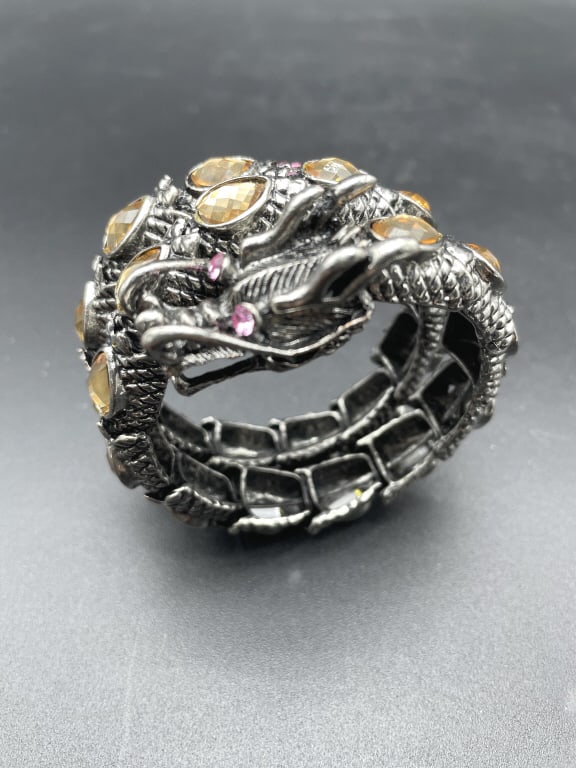 DRAGON WRAP METAL BRACELET: DRAGON WRAP METAL BRACELET-SIZE APPROX 2.5"D-VERY GOOD PRE OWNED CONDITION-BL32224 This item can qualify for in-house shipping. Please contact us if you would like to use this service after winni
