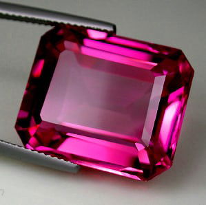 61.80 CT RADIANT PINK SAPPHIRE GEMSTONE: SAPPHIRE Color: Radiant Pink Size: 20.0mm x 25.0mm Weight: 61.80 cts. / 9 Shape: Emerald Cut Clarity: IF Luster: Excellent Origin: Switzerland Condition: New Treatment: Lab Grown SKU: 008