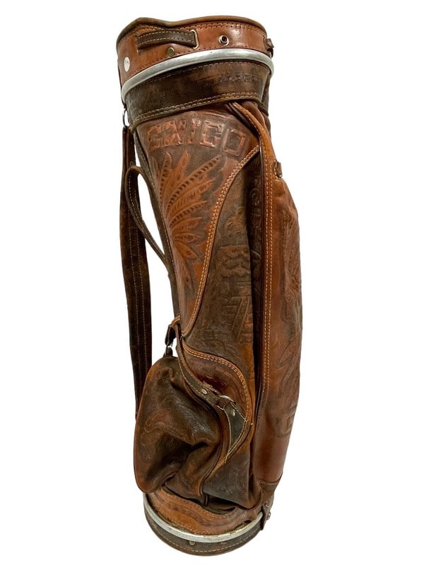 VINTAGE ALL LEATHER INDIAN WESTERN GOLF BAG: VINTAGE ALL LEATHER INDIAN AZTEC WESTERN GOLF BAG STAMPED MEXICO -31.5" X 9" DIAMETER APPROX -GOOD PRE OWNED CONDITION, MINOR WEAR -DP52124ST Bidders may pick up their items from the auction-house or