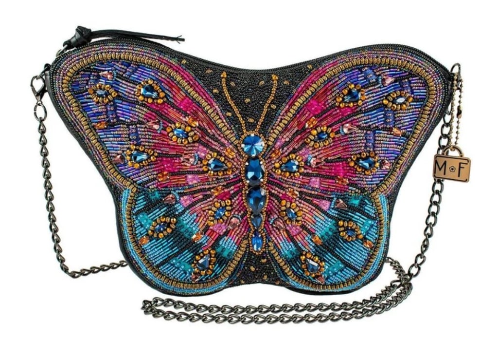 MARY FRANCES "JEWELS" BUTTERFLY HANDBAG: MARY FRANCES "JEWELS" BUTTERFLY HANDBAG -11 x 1.5 x 7" -Strap Length End to End: 49" -Strap Drop: 23" -Removable crossbody chain strap, zipper closure, back pocket, inside pocket, fits a cell phone, g