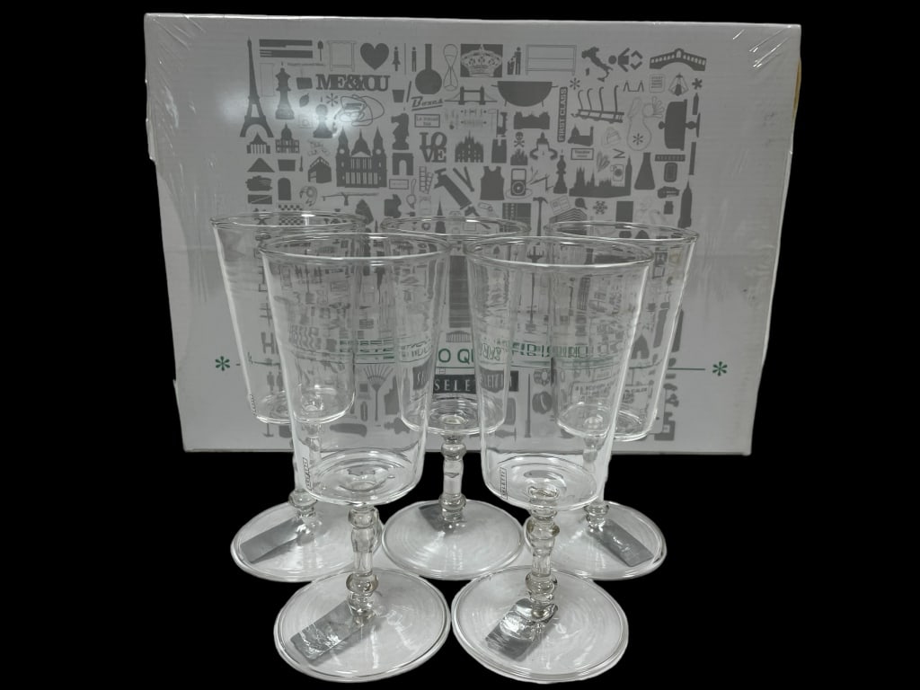 NEW! ESTETICO QUOTIDIANO SELETTI WINE GLASSES: ESTETICO QUOTIDIANO SELETTI 11 WINE GLASS SET -ITEM CONDITION New -MA070224 Bidders may pick up their items from the auction-house or have their items shipped. Some items qualify for in-house s