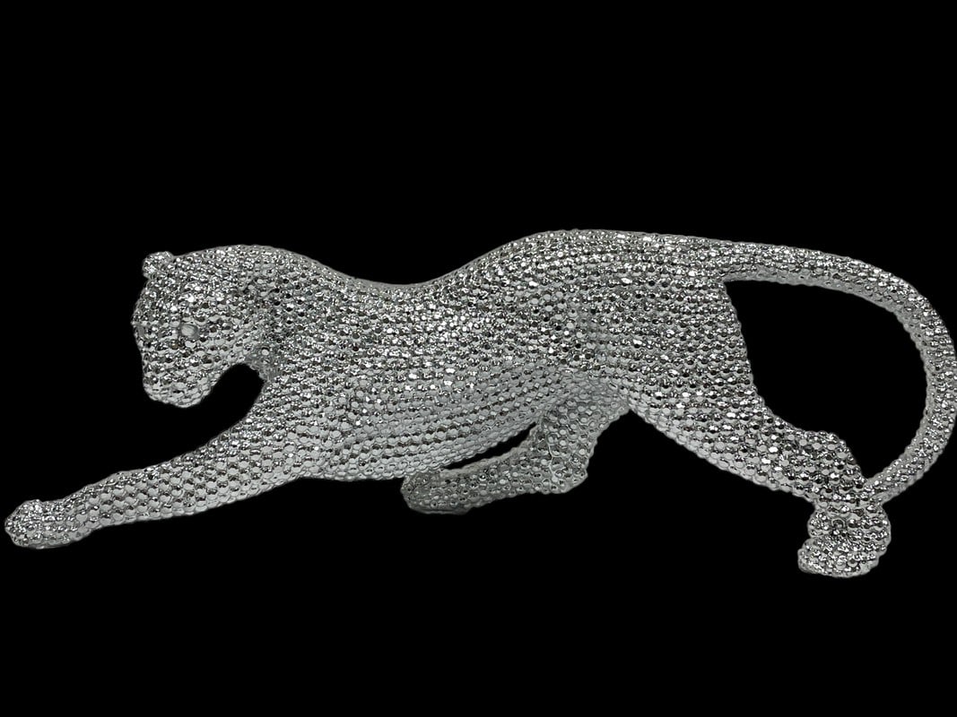 SILVER PROWLING LEOPARD ACCENT SCULPTURE 15": SILVER PROWLING LEOPARD ACCENT SCULPTURE -6" H X 15" X 3" APPROX -VERY GOOD PRE OWNED CONDITION -DP71024 Bidders may pick up their items from the auction-house or have their items shipped. ***A