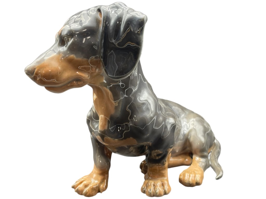 B&G DACHSHUND PORCELAIN FIGURINE #1691 8.5": -BING & GRONDAHL DACSHUND PORCELAIN FIGURINE -DACHSHUND PORCELAIN FIGURINE #1691 8.5" -ITEM CONDITION VERY GOOD -MEASURES 8.5 -MA071624 Bidders may pick up their items from the auction-house or