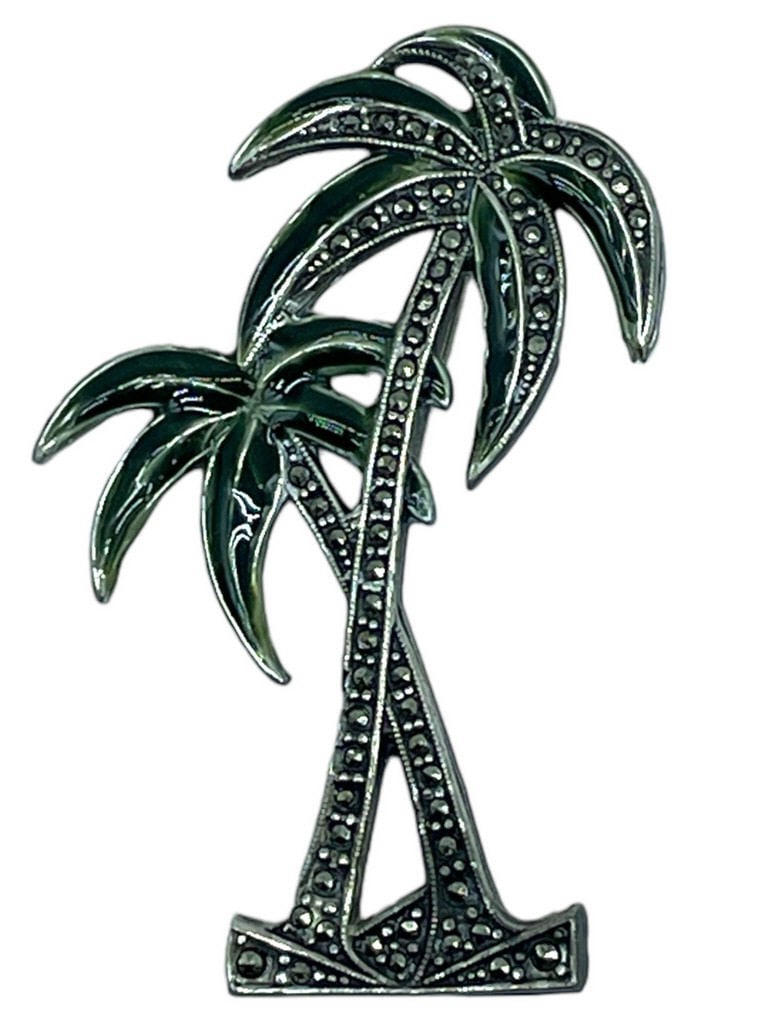 STERLING SILVER & MARCASITE STONES PALM TREE PIN: STERLING SILVER & MARCASITE STONES PALM TREE PIN -VERY GOOD PRE-WNED CONDITION -ABOUT 2" -5 DWT -7.8 GRAMS -VERY GOOD PRE OWNED CONDITION -DP82024 Bidders may pick up their items from the aucti