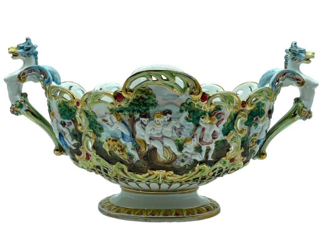 CAPODIMONTE TWIN HANDLED PORCELAIN JARDINIERE 18": CAPODIMONTE TWIN HANDLED PORCELAIN JARDINIERE -9" X 18" APPROX -VERY GOOD PRE OWNED CONDITION -DP82624 Bidders may pick up their items from the auction-house or have their items shipped. Some i