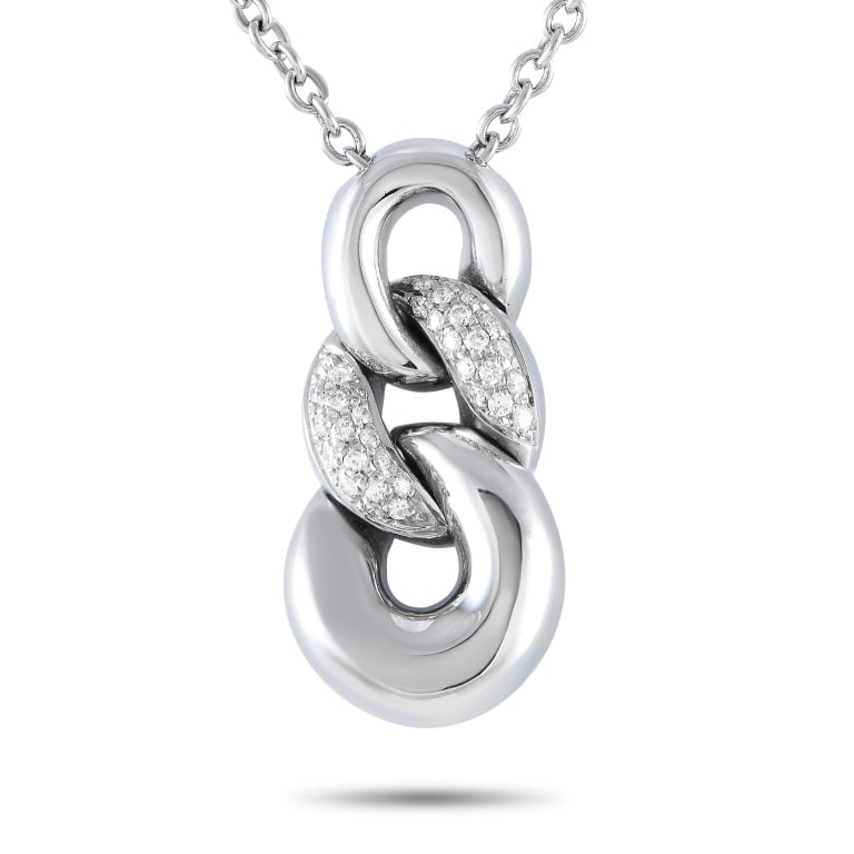 Bucherer 18K White Gold 0.35ct Diamond Curb Link 4: A striking 18K white gold pendant measuring 1.25 long by 0.65 wide makes a statement on this exquisite Bucherer necklace. The pendant is accented by sparkling diamonds totaling 0.35 carats and is susp