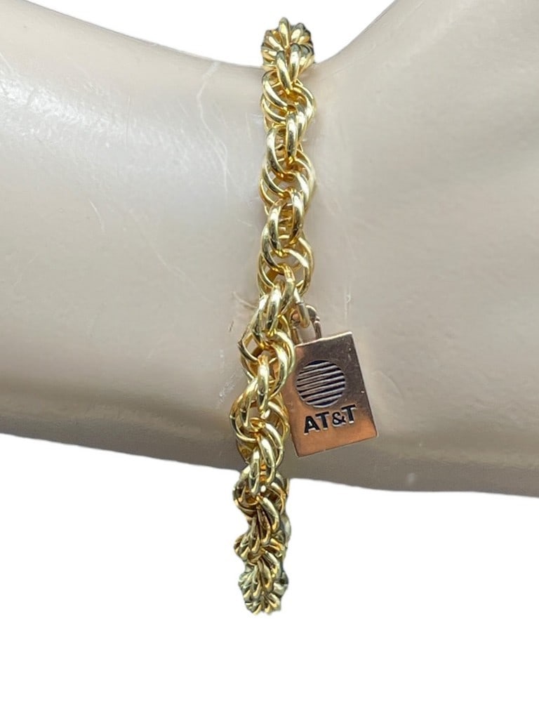 10 K GOLD CHARM BRACELET WITH GP BRACELET 2 G: 10 K GOLD CHARM BRACELET WITH GP BRACELET -2 GRAMS TOTAL WEIGHT -VERY GOOD PRE OWNED CONDITION -DP11524