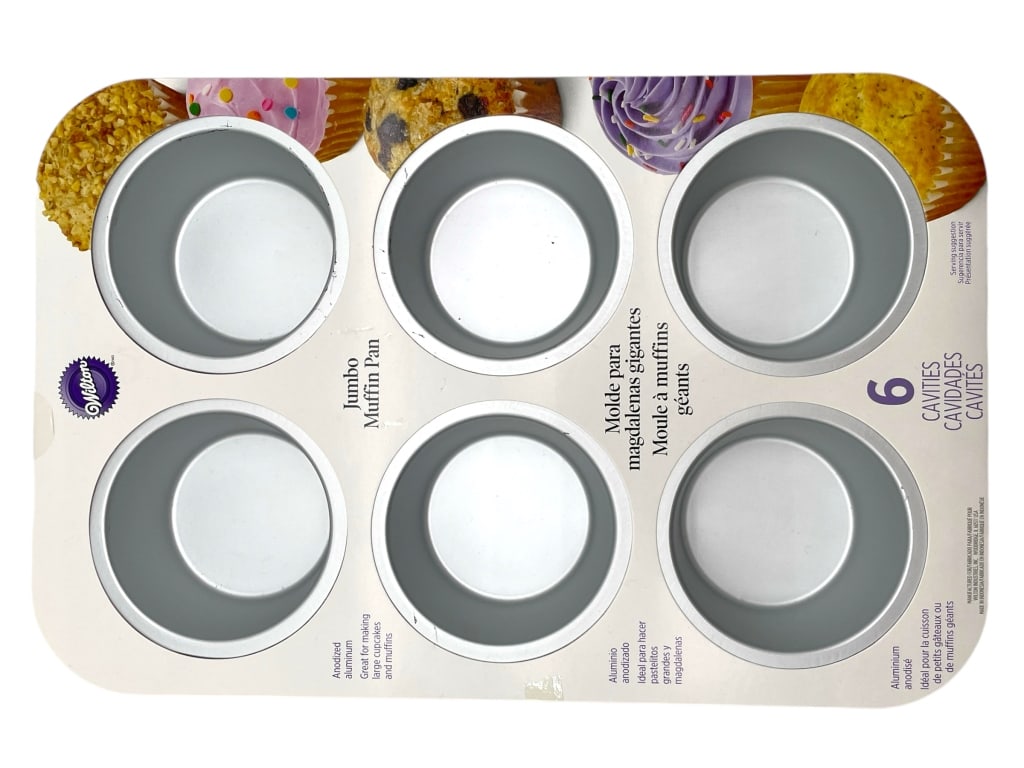 NEW WILTON JUMBO MUFFIN PAN: NEW WILTON JUMBO MUFFIN PAN -NEW -TWO OF TWO -APPROX 14.5" X 9.5" -JA 111224 #17 ***Please note that due to limited storage space, all items must be picked up within 14 days of the auction's conclusio