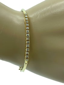 14K GOLD AND DIAMOND BANGLE BRACELET IN BOX