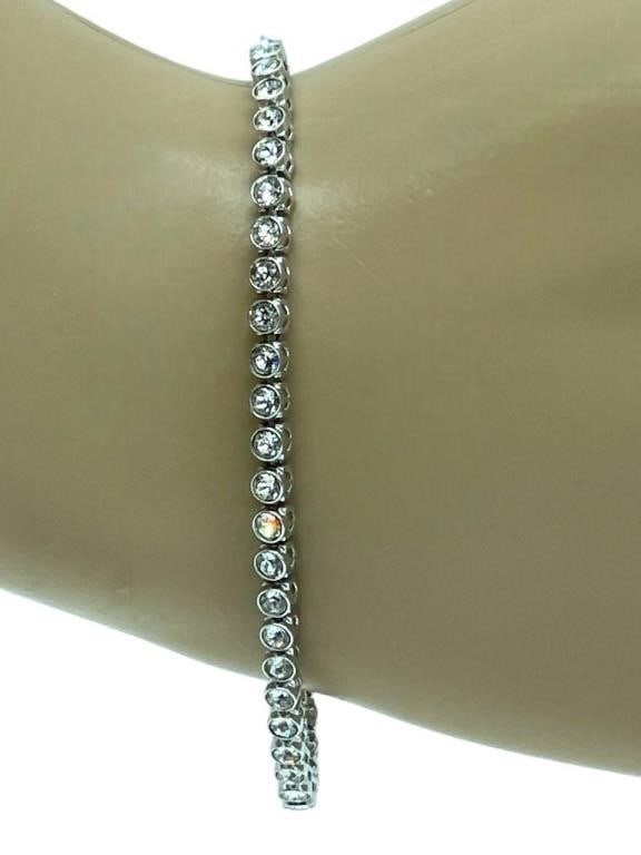 SWAROVSKI CRYSTAL TENNIS BRACELET 7": SWAROVSKI CRYSTAL TENNIS BRACELET -7" APPROX -1 OF 2 SIMILAR -VERY GOOD PRE OWNED CONDITION -DP82020