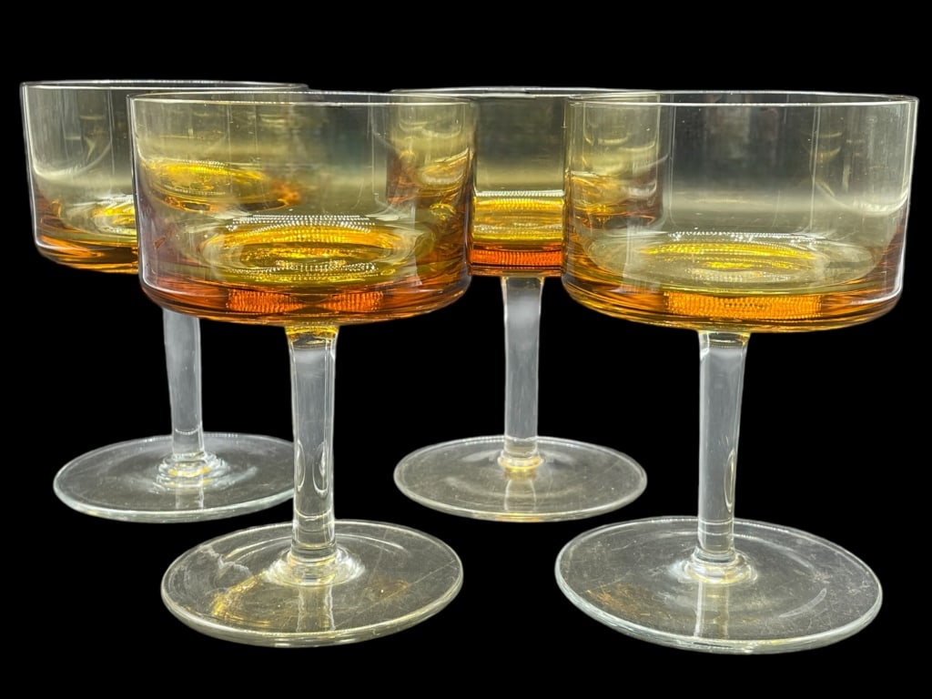 SET OF FOUR OMBRE ORANGE GLASSES: SET OF FOUR OMBRE ORANGE GLASSES -VERY GOOD CONDITION -APPROX 5" TALL -JA 111924 #24 ***Please note that due to limited storage space, all items must be picked up within 14 days of the auction's concl