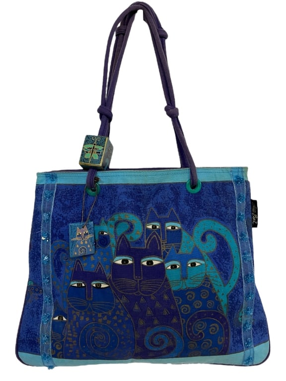 LAUREL BURCH INDIGO CATS TOTE BAG: LAUREL BURCH INDIGO CATS TOTE BAG -VERY GOOD CONDITION -APPROX 13" X 17", HANDLE 13" -JA 120224 ***Please note that due to limited storage space, all items must be picked up within 14 days of the auct
