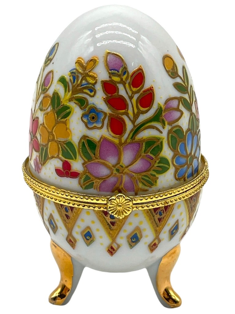 PAINTED EGG SHAPED FOOTED TRINKET BOX: PAINTED EGG SHAPED FOOTED TRINKET BOX -VERY GOOD CONDITION -APPROX 4" TALL -JA 120924 ***Please note that due to limited storage space, all items must be picked up within 14 days of the auction's conc