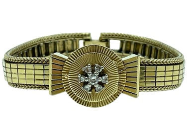 14 K GOLD AND DIAMOND ETTA BRACELET WATCH 36.6 G