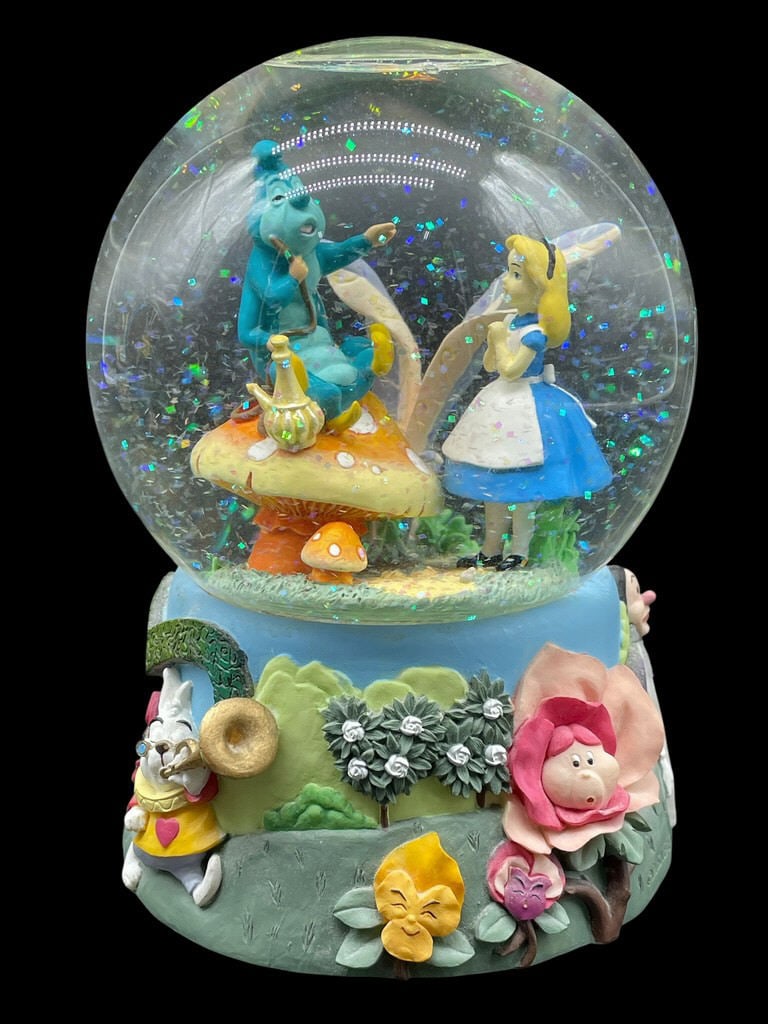ENESCO DISNEY ALICE IN WONDERLAND SNOW GLOBE: ENESCO DISNEY MUSICAL SNOW GLOBE -ALICE IN WONDERLAND -6" APPROX -NOCTURNE -VERY GOOD PRE OWNED CONDITION -DP122024 - ***Please note that due to limited storage space, all items must be picked up with