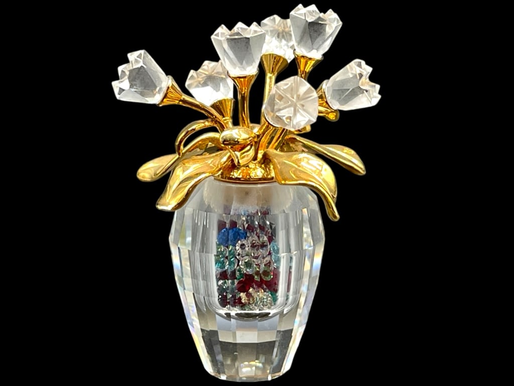 SWAROVSKI CRYSTAL SPRING FLOWER VASE FIGURINE 2": SWAROVSKI CRYSTAL SPRING FLOWER VASE FIGURINE 2" -VERY GOOD CONDITION -APPROX 2" TALL -JA 010325 FRONT ***Please note that due to limited storage space, all items must be picked up within 14 days of t