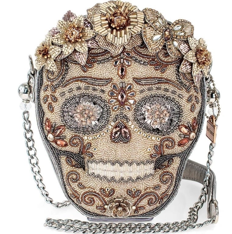 NEW MARY FRANCES SHING SKULL CROSSBODY HANDBAG: NEW MARY FRANCES SHING SKULL CROSSBODY HANDBAG Indulge in luxurious style with our mixed metallics sugar skull crossbody handbag. Adorned with hand-beaded metallic florals, this statement accessory is