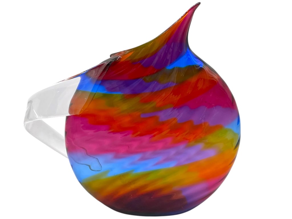 MARK WEINER RAINBOW ART GLASS PITCHER 11": MARK WEINER RAINBOW ART GLASS PITCHER 11" -VERY GOOD PRE OWNED CONDITION -APPROX 11" -ARTIST STAMP -JA 021225 ***Please note that due to limited storage space, all items must be picked up within 14 da