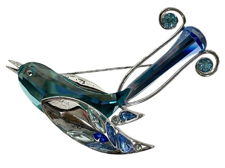 SWAROVSKI STERLING BIRD OF PARADISE BROOCH: SWAROVSKI STERLING BIRD OF PARADISE BROOCH -GOOD PRE OWNED CONDITION, SOME SCRATCHES ON SILVER WINGS -APPROX 3" LONG -ORIGINAL RETAIL $140 -JA 122724 FRONT ***Please note that due to limited storage s