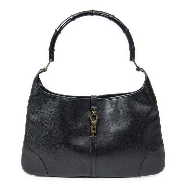 GUCCI LOBSTER CLASP JACKIE CALF LEATHER BAG: GUCCI LOBSTER CLASP JACKIE CALF LEATHER SHOULDER BAG BLACK CALF LEATHER DIMENSIONS: 15.7x9.4x0.4 IN CONDITION RATING: AB ABA8754 SP030525 --- Please note that due to limited storage space, all i