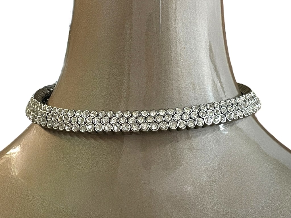 SILVER RHINESTONE CHOKER NECKLACE: SILVER RHINESTONE CHOKER NECKLACE -VERY GOOD PRE OWNED CONDITION -APPROX 5" -DAZZLING RHINESTONE CHOKER NECKLACE FEATURING MULTIPLE ROWS OF SPARKLING CLEAR CRYSTALS SET IN A SLEEK SILVERTONE METAL. TH