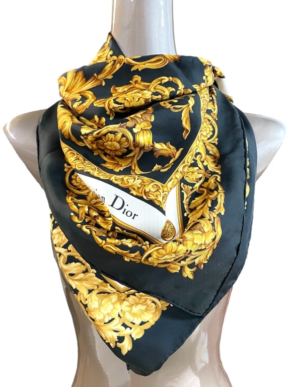 CHRISTIAN DIOR BLACK & GOLD SILK SCARF 34": CHRISTIAN DIOR BLACK & GOLD SILK SCARF 34" -VERY GOOD PRE OWNED CONDITION -APPROX 34" -CHRISTIAN DIOR VINTAGE SILK SCARF FEATURING AN OPULENT BAROQUE FLORAL DESIGN IN GOLD ON A BLACK BACKGROUND. LUXUR