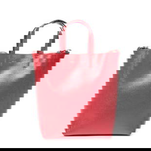 CELINE SMALL VERTICAL CABAS TOTE LEATHER HANDBAG: This striking Celine Small Vertical Cabas Tote delivers bold minimalism in a vivid red textured calf leather. Its structured silhouette and subtle silver logo accent embody modern Parisian sophisticat