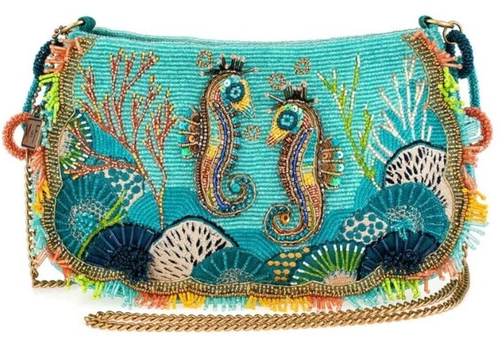 NEW MARY FRANCES REEF RIDER CROSSBODY HANDBAG: NEW MARY FRANCES REEF RIDER CROSSBODY HANDBAG DIVE INTO OCEANIC CHARM WITH THE 'REEF RIDER' HANDBAG, WHERE TWO BEJEWELED SEAHORSES SWIM AMIDST SPARKLING CORAL REEFS AND SEA FANS. THIS VIBRANT AND PLAY