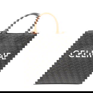 CELINE SMALL CABAS TRIOMPHE CANVAS HANDBAG: A modern staple with classic Parisian flair, this Celine Small Vertical Cabas is rendered in signature Triomphe coated canvas with sleek black and brown tones. The bold CELINE logo front adds contempo