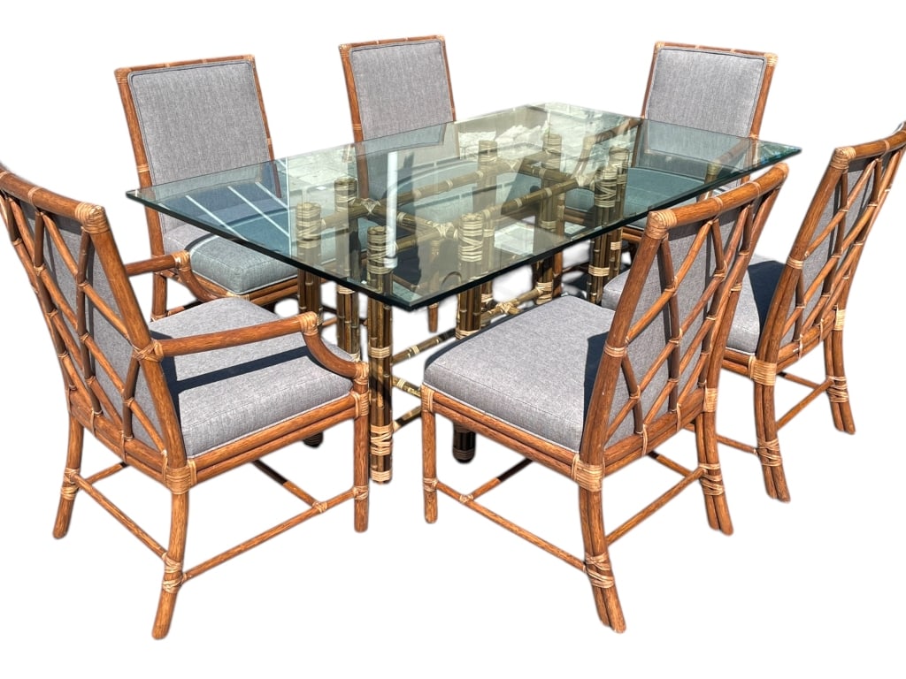 MCGUIRE BAMBOO RATTAN DINING TABLE & 6 CHAIRS: MCGUIRE DINING SET FEATURES A BAMBOO AND RATTAN RECTANGLE FRAME WITH RECTANGULAR GLASS TOP. SIX CHAIRS HAVE LATTICE-STYLE BACKS, RAWHIDE BINDINGS, AND GRAY UPHOLSTERED SEATS. THE TABLE BASE HAS BRASS