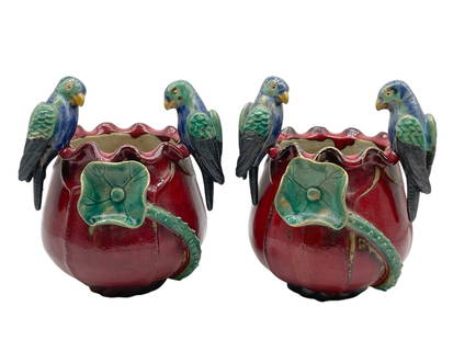 PAIR OF MAJOLICA-STYLE CERAMIC PLANTERS 9": PAIR OF COLORFUL MAJOLICA-STYLE CERAMIC PLANTERS 9" -VERY GOOD PRE OWNED CONDITION -APPROX 9" -WITH SCULPTED PARROTS AND FLORAL MOTIFS. VIBRANT GLAZED FINISH WITH DEEP RED, GREEN, AND BLUE TONES. CHAR