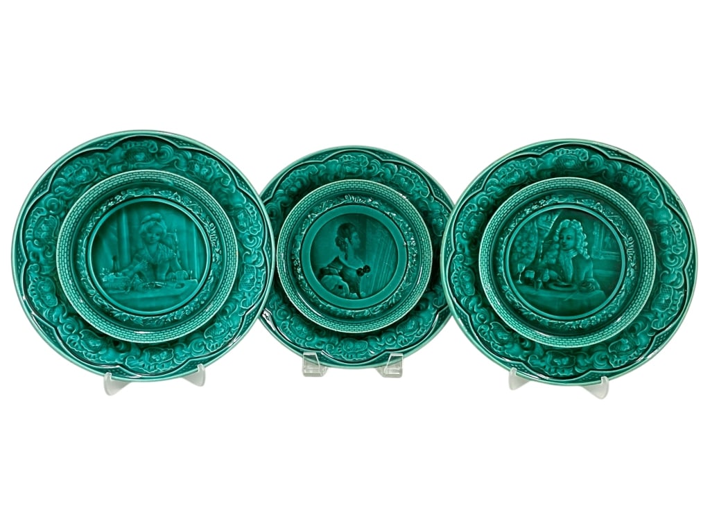 SET OF 3 BREVET MAJOLICA PORTRAIT WALL PLATES 8": SET OF 3 BREVET MAJOLICA PORTRAIT WALL PLATES 8" -VERY GOOD PRE OWNED CONDITION -SET OF 3 PLATES -APPROX 8" -DETAILED RELIEF SCENES OF FIGURES DINING, EACH SURROUNDED BY ORNATE FLORAL AND SCROLLWORK B