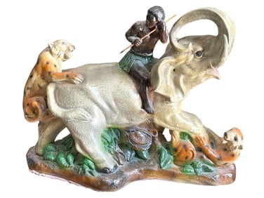 HAND-PAINTED FIGURAL SCULPTURE OF MAN ON ELEPHANT