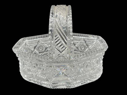AMERICAN BRILLIANT CLEAR CUT GLASS BASKET 9": AMERICAN BRILLIANT CUT GLASS BASKET -EXCEPTIONAL AMERICAN BRILLIANT PERIOD CUT GLASS BASKET WITH DEEPLY CUT GEOMETRIC AND STARBURST PATTERNS. INTRICATE HANDLE DESIGN WITH PRISMATIC CLARITY. EXCELLENT