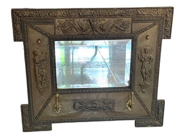 ANTIQUE WALL MIRROR WITH EMBOSSED FIGURAL FRAME